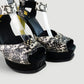 Sandalias de plataforma marca Fendi en piel animal print