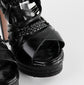 Sandalias de Tacón Prada en Piel Negra con Hebilla Dorada