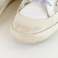 Tenis casuales Golden Goose Super Star en piel blanca.