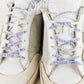Tenis casuales Golden Goose Super Star en piel blanca.
