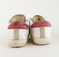 Tenis casuales Golden Goose Super Star en piel blanca.